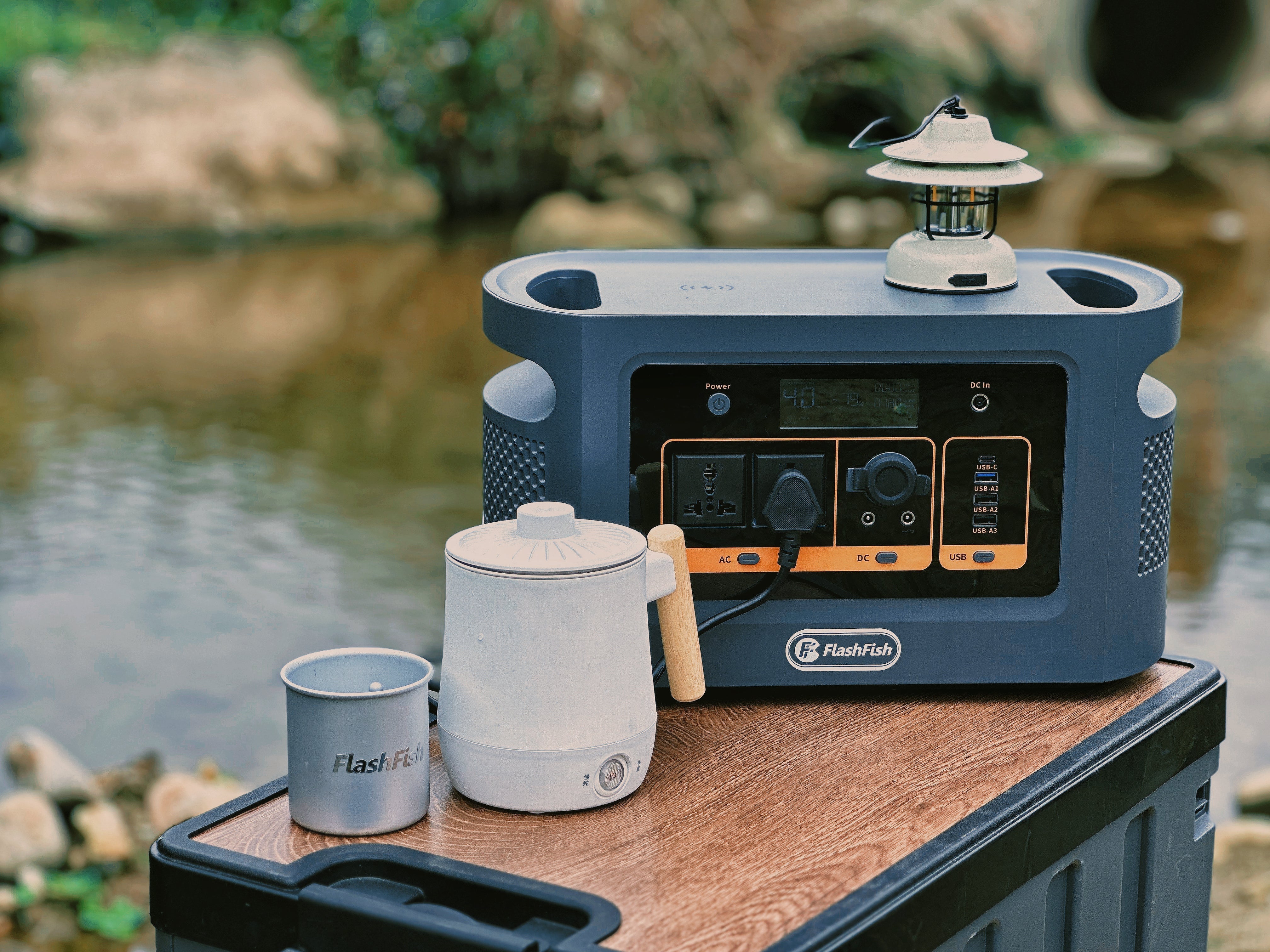 Compact portable power station in a campsite-style outdoor setup