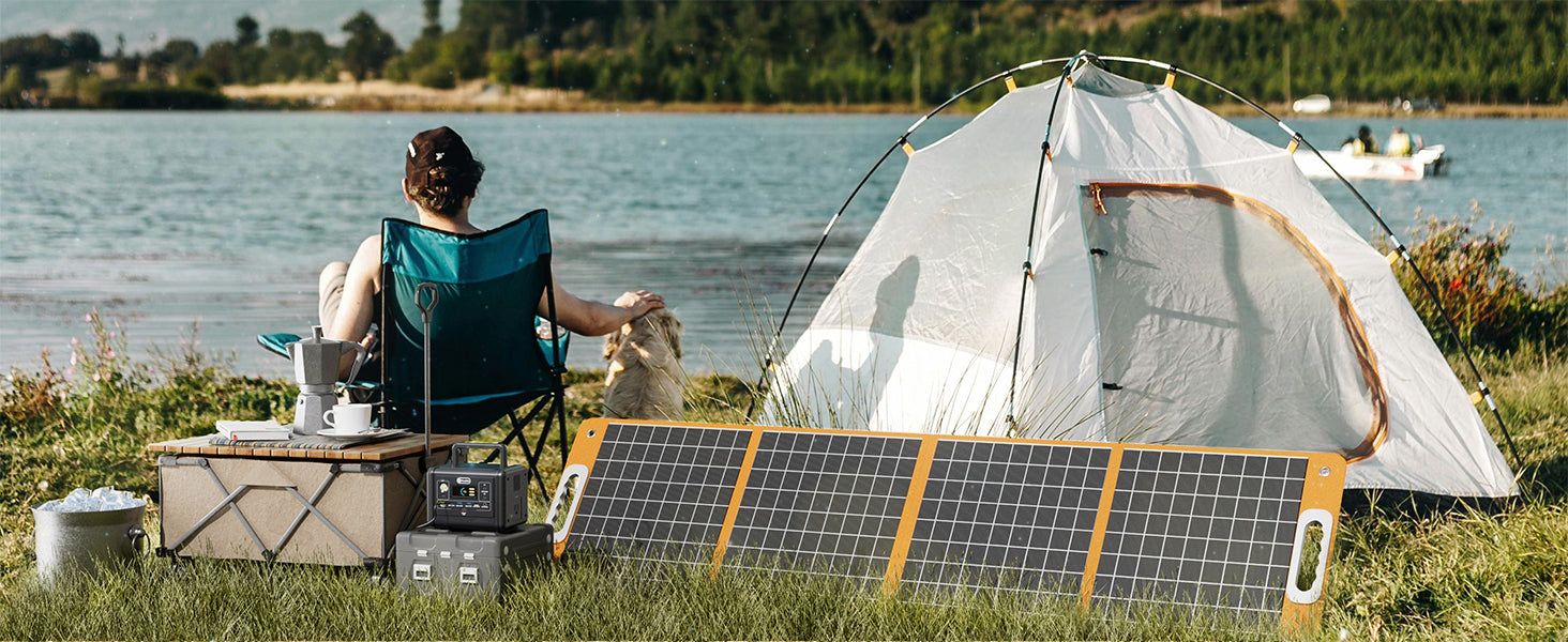 FlashFish T200 and TSP60 charging beside a lakeside light-camping setup